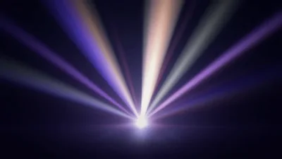 Multi Colored Stage Spotlight Beams Rotating In Dark Space