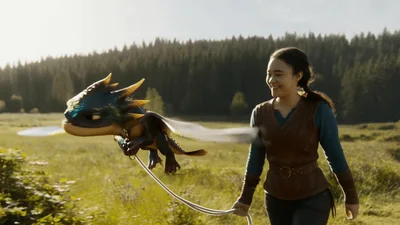 Young Woman Walking With A Small Flying Dragon
