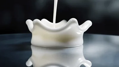 White Milk Droplet Creating A Crown Splash