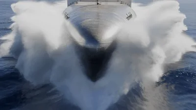 Modern Naval Warship Sailing Through Open Ocean Waters
