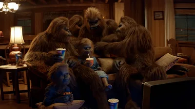 Sasquatch Family Eating Snacks While Watching Television