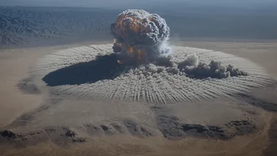 Massive Nuclear Explosion Expanding Over Desert Landscape