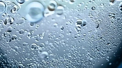 Macro Shot Of Effervescent Bubbles Rising In Liquid