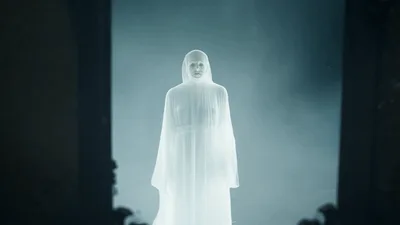 Ghostly Figure Appearing In An Antique Wall Mirror