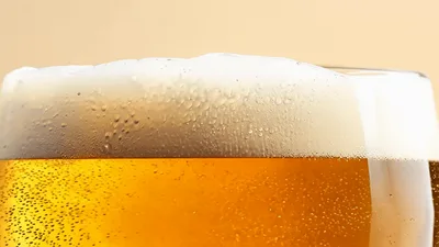 Close Up Of Beer Bubbles Rising In A Glass