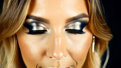 Close Up Of Woman With Glamorous Makeup Looking Down