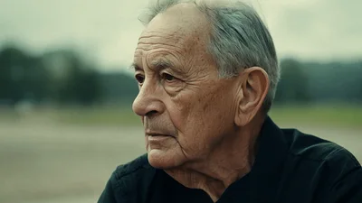 Elderly Man Sitting Alone On A Park Bench