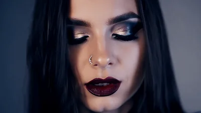 Close Up Portrait Of A Woman With Dramatic Makeup