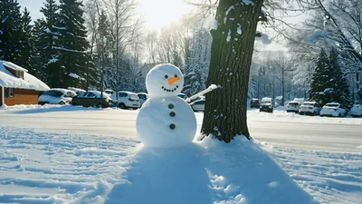 Snowman Standing Beside A Tree In Snowy Landscape