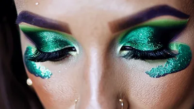 Close Up Of Woman With Dramatic Green Glitter Makeup