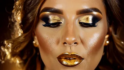 Glamorous Woman With Metallic Gold Makeup Posing