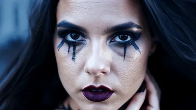 Gothic Woman With Dark Makeup Staring Into Camera