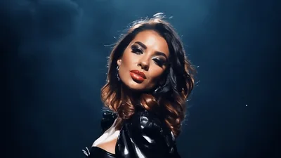 Glamorous Woman With Red Lips Posing In Dark Studio