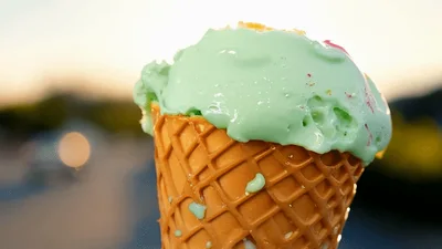 Melting Mint Ice Cream Cone In Sunset Light