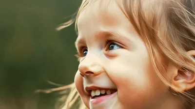 Happy Little Girl Smiling Outdoors