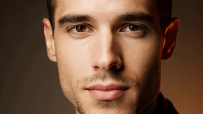 Close Up Portrait Of A Handsome Man Looking At Camera
