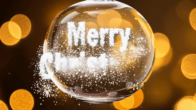 Merry Christmas Text Appearing Inside A Glass Ornament