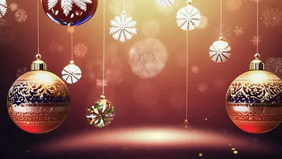 Hanging Christmas Ornaments With Falling Snowflakes Background