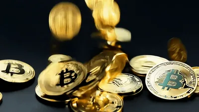 Golden Bitcoin Coins Falling Onto A Dark Surface
