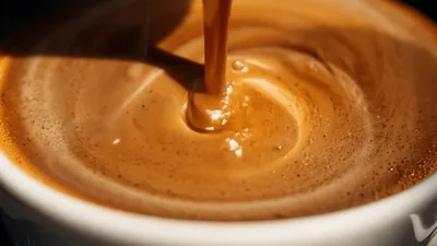 Espresso Pouring Into Cup Creating Heart Latte Art