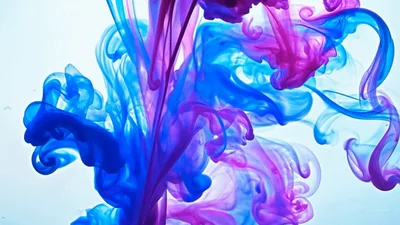 Blue And Magenta Ink Swirling In Water