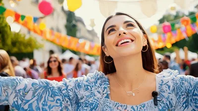 Young Woman Smiling and Celebrating at Outdoor Street Festival