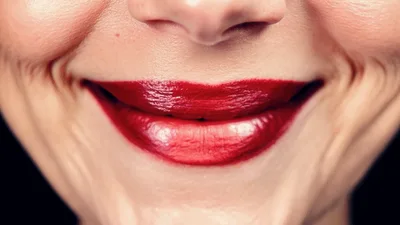 Close Up Of Woman Smiling And Pouting Lips