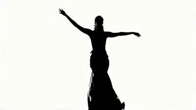 Silhouette Of A Woman Dancing In A Long Dress