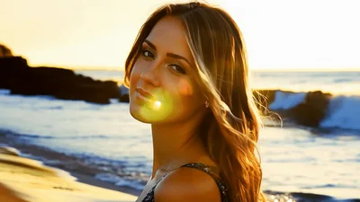 Beautiful Woman Smiling On Beach At Sunset