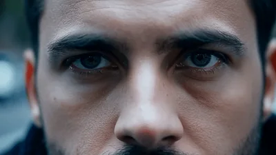Close Up Portrait Of A Serious Man Staring