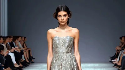 Fashion Model Walking Down The Runway In Silver Dress