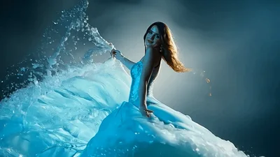 Woman In Blue Gown With Water Splash Effect