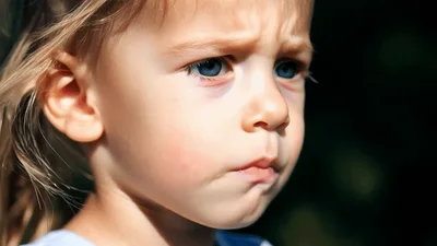 Close Up Portrait Of A Sad Little Girl