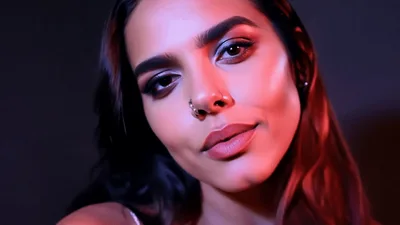 Young Woman With Nose Ring Posing For Camera