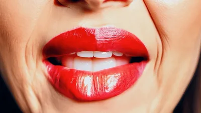 Close Up Of Woman With Red Lipstick Smiling And Pouting