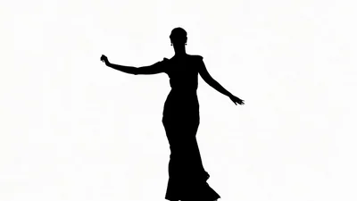 Silhouette Of A Graceful Woman Dancing In A Long Dress
