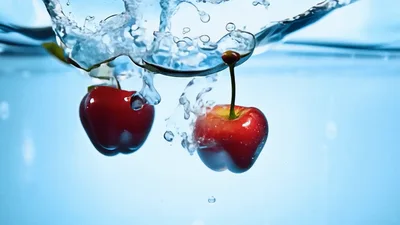 Fresh Red Cherries Dropping Into Clear Water