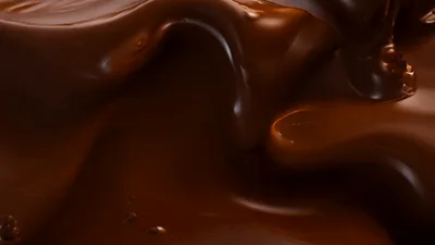 Liquid Dark Chocolate Flowing In Slow Motion