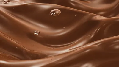 Liquid Chocolate Waves With Floating Droplets