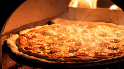 Pepperoni Pizza Baking Inside A Wood Fired Oven