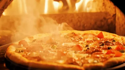 Pizza Baking Inside A Hot Wood Fired Oven