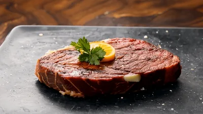 Grilled Beef Steak Resting On A Slate Plate