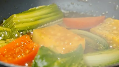 Vegetables And Tofu Sautéing In A Hot Pan