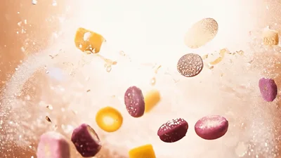 Assorted Colorful Candies Exploding In Slow Motion