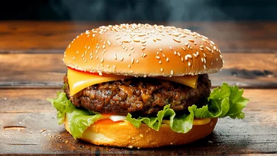 Fresh Cheeseburger With Steam On Wooden Table