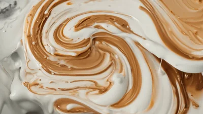 White And Brown Cream Swirling Together