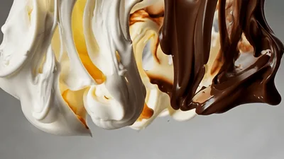 White And Dark Chocolate Streams Pouring Together