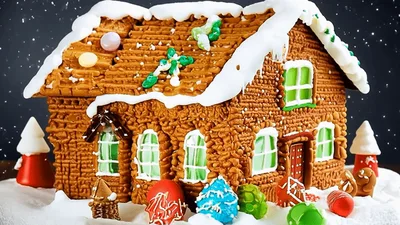 Gingerbread House Decorated With Candy In Snowy Setting