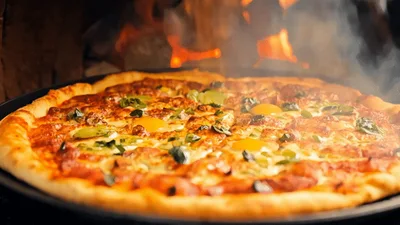Fresh Pizza Baking In A Wood Fired Oven