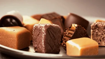 Assorted Gourmet Chocolates Rotating on a Metal Plate